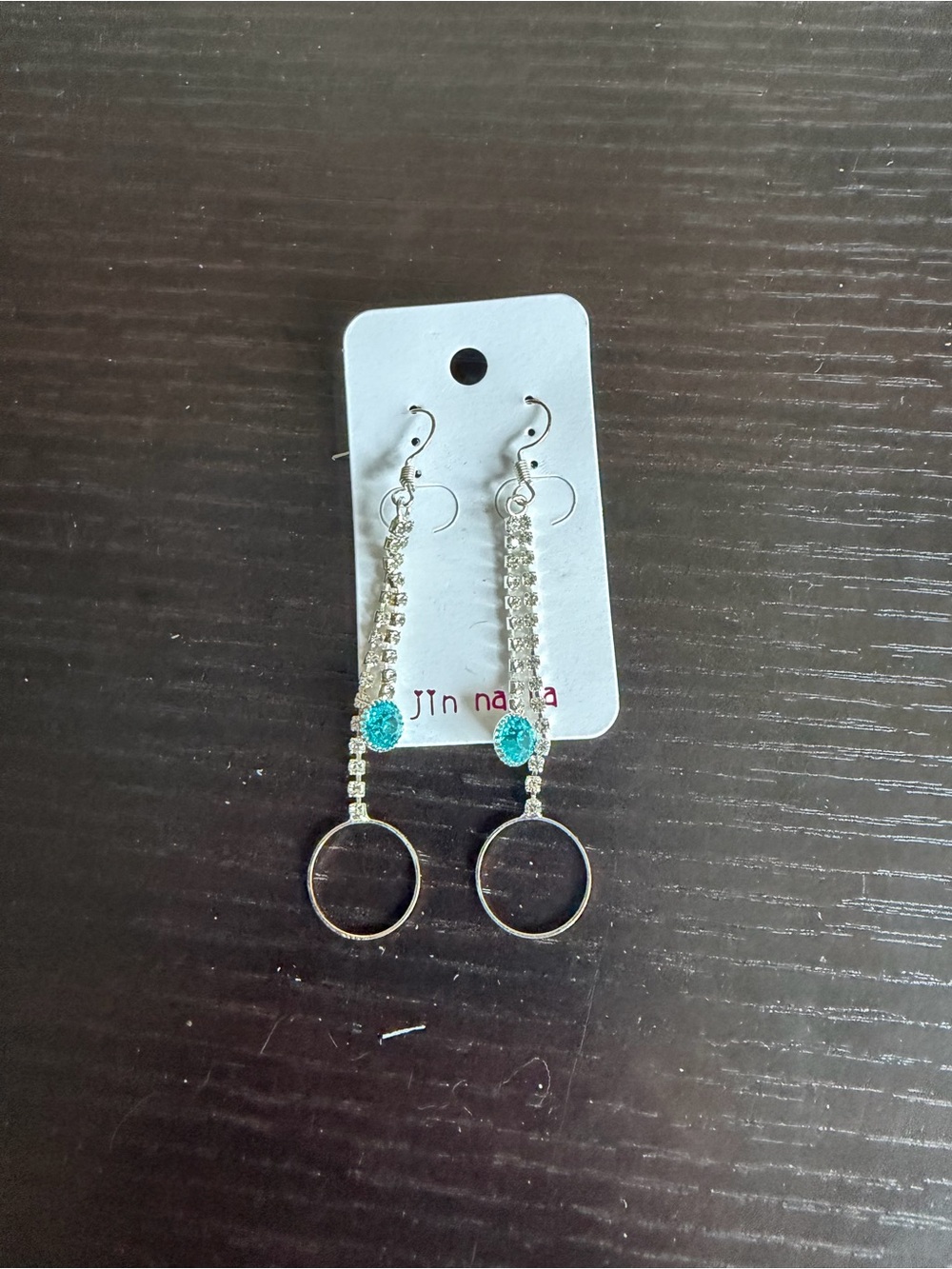 Silver-tone dangle earrings with teal rhinestones and hoop